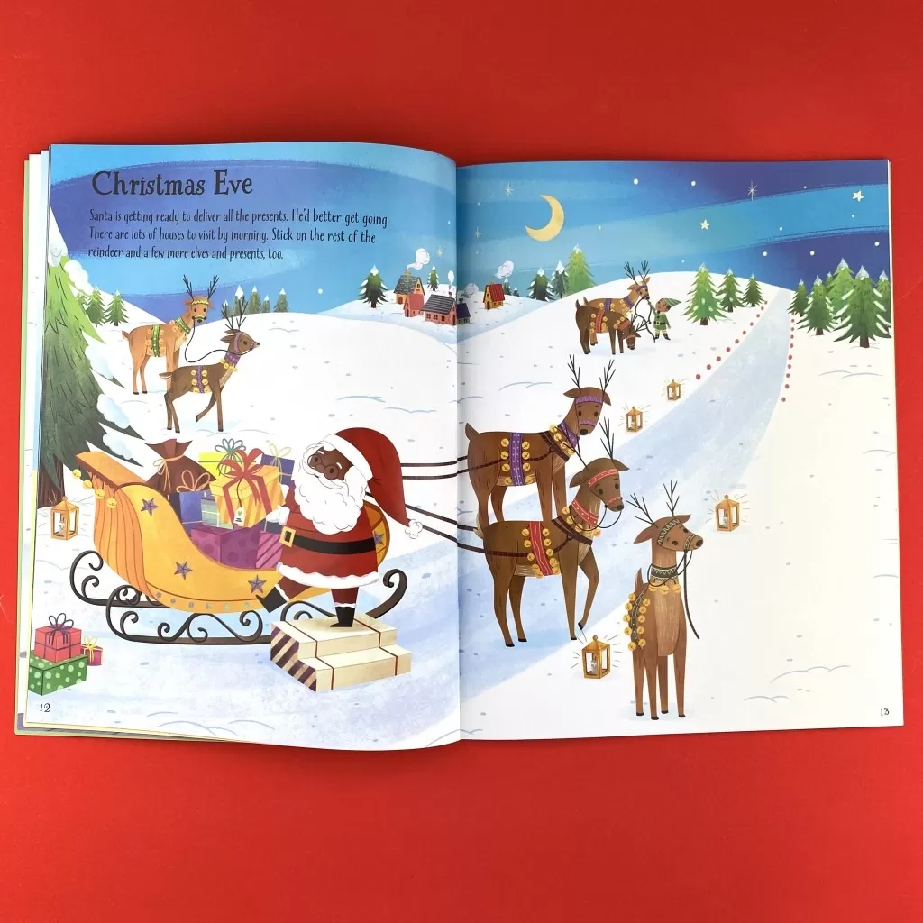 An interior spread of First Sticker Book Christmas: A Christmas Sticker Book for Children showing a Black Santa about to bard the sleigh led by reindeer.