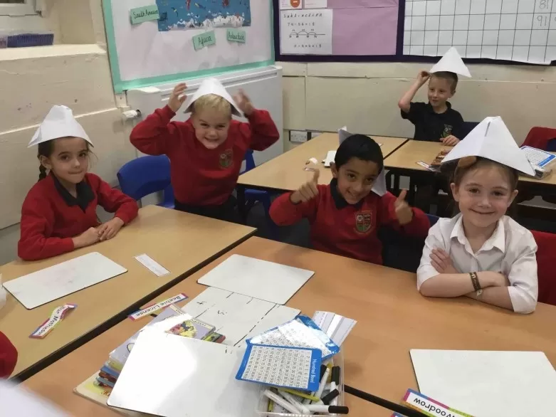 Children wearing the paper paddington hats they made